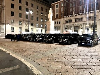 Cagnato executive vehicles lined up in front of Palazzo della Borsa in Milan